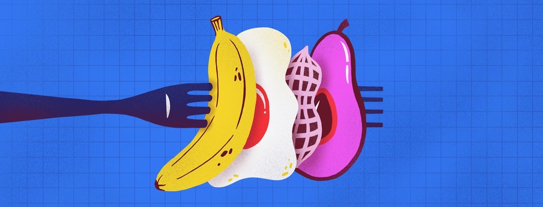 Banana, egg, peanut, and avocado on a fork