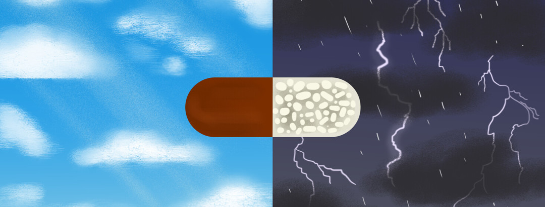 An antibiotic pill in front of a split background, one with sunshine and blue skies, the other with dark skies and lightning bolts