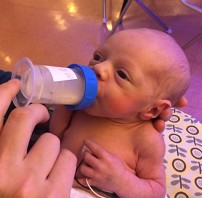 Margo drinking her bottle in the NICU