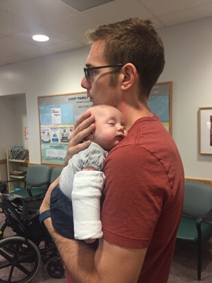 rhett holding margo as they wait for her sweat test results