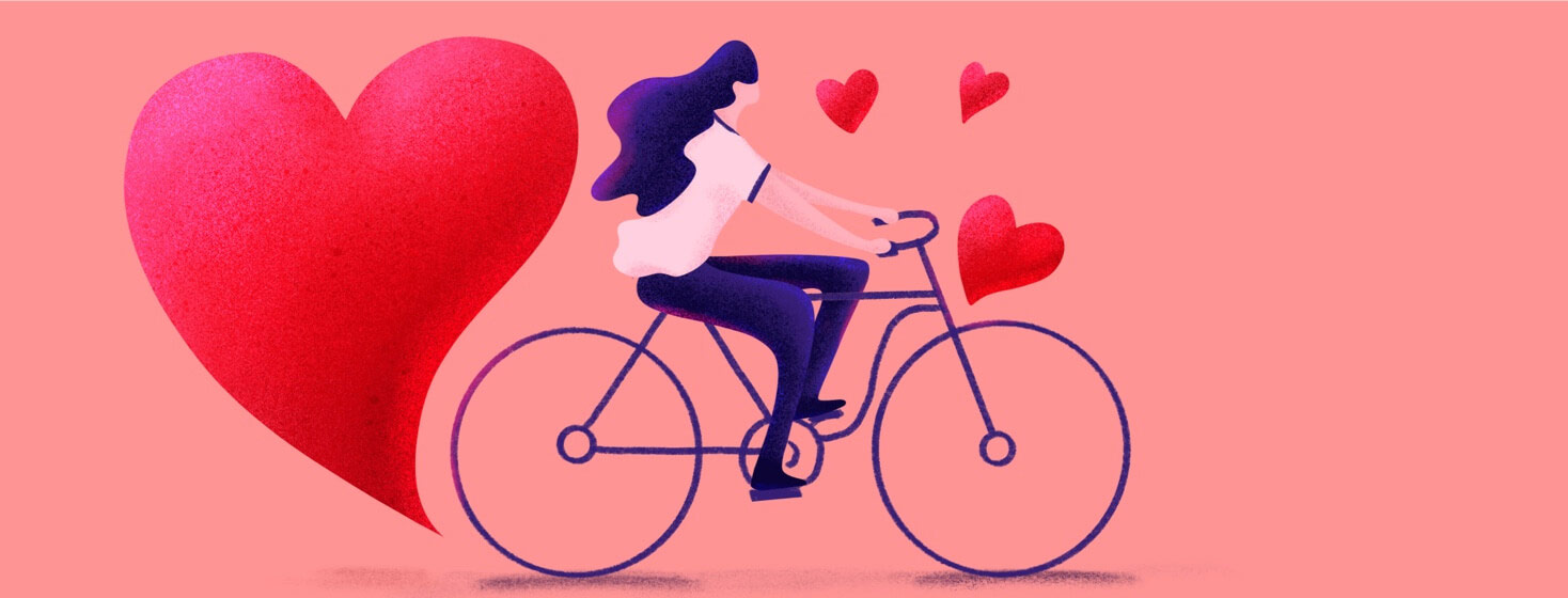 A woman riding her bike surrounded in hearts